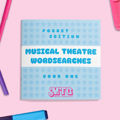 Book titled 'Musical Theatre Wordsearches Book One' with star pattern on a pink background