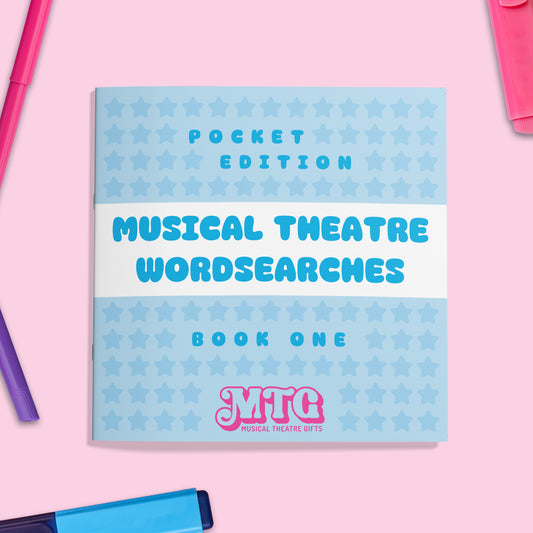Book titled 'Musical Theatre Wordsearches Book One' with star pattern on a pink background